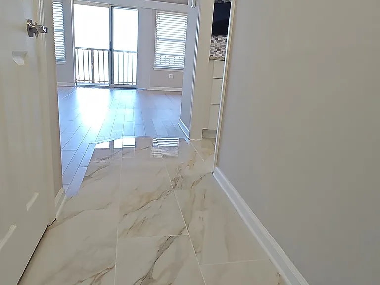 Entry with Designer high gloss Tile floor