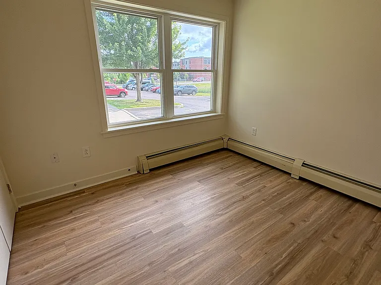 bedroom three. double door closet across from window.