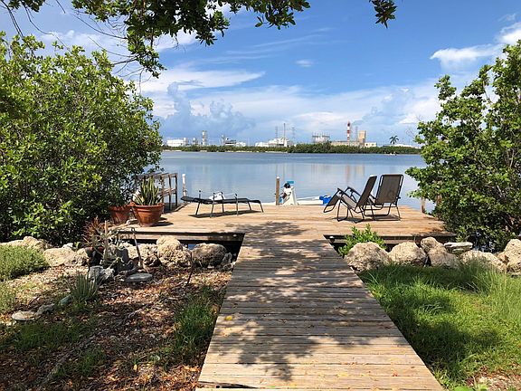 Wooden deck leads to dock.