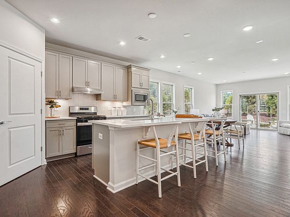 Kitchen with Stone Gray Cabinets and Artic White Quartz Countertops