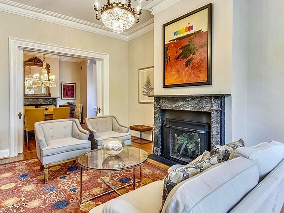 Living room with wood burning fireplace.