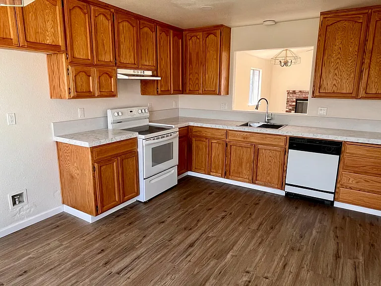 Kitchen (stainless-steel double door fridge is included, not pictured).