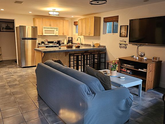 Looking in from private entrance.
Living area and kitchen beyond.