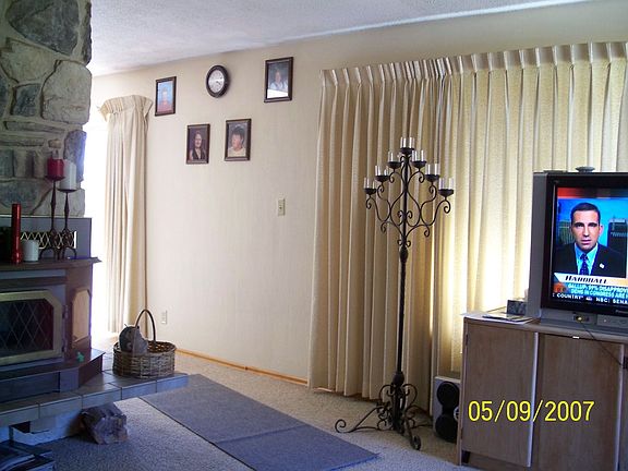 Rock wall fireplace (living)