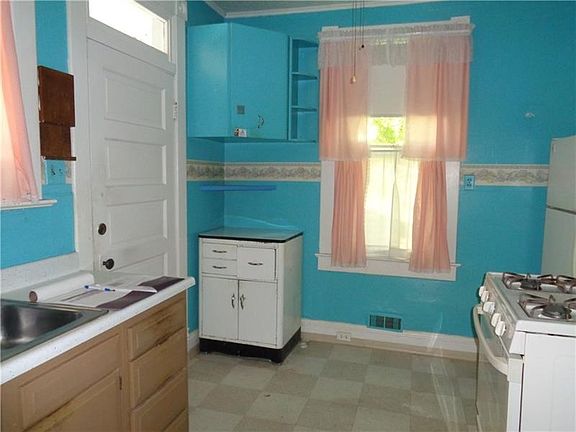 Kitchen with Gas Stove and Refrigerator