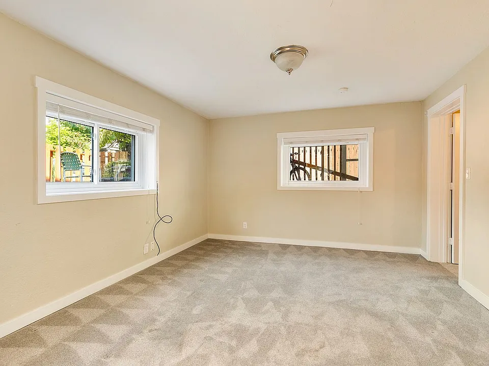 Living room and entrance to primary bedroom