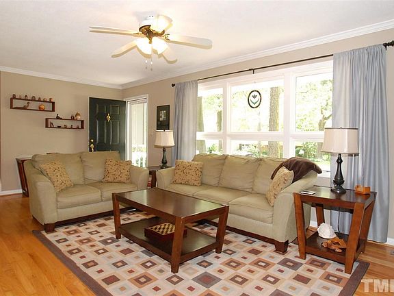 Large, Bright, Open Living Room with Hardwoods & Ceiling Fan with Light.