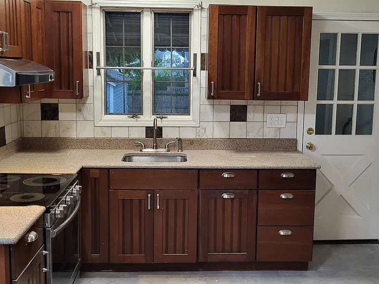 Kitchen, with energy efficient induction cooktop/oven.
