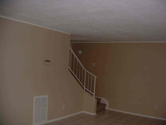 Living room looking to stairway