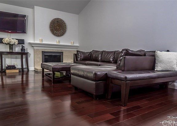 Fireplace is upgraded with marble tiles facade.