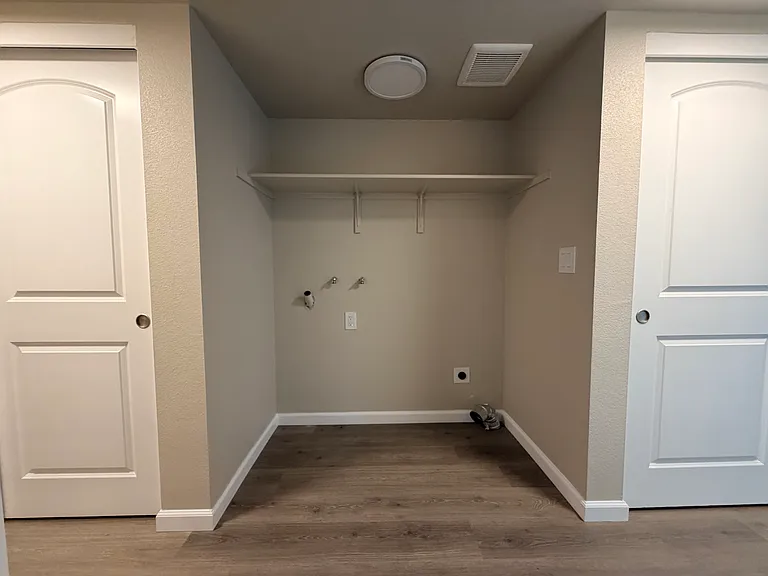 Washer/Dryer space in hallway.