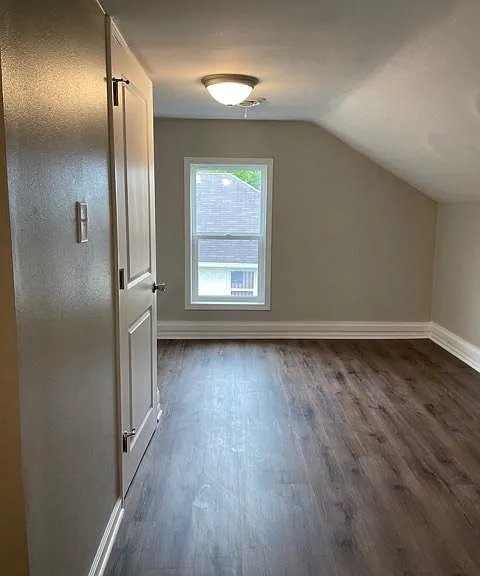 Open space upstairs. This could be an office, playroom or storage. Half bathroom on left and laundry hook-ups available to the left of the window.