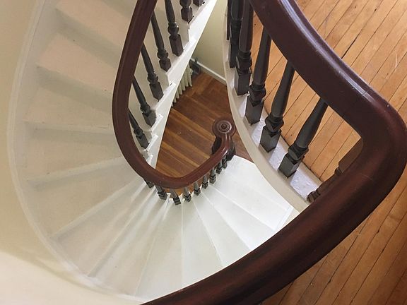 Spiral stairs to the second floor apartment.