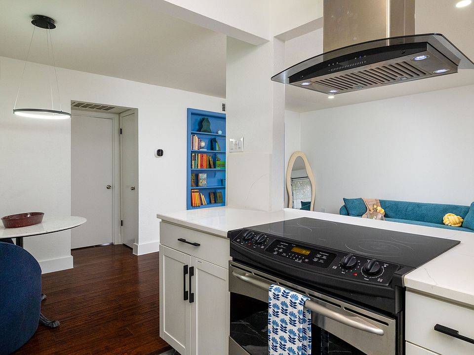 Cook with ease in this modern kitchen featuring stainless steel appliances, sleek countertops, and stylish cabinetry. Fully equipped for meals and late-night snacks.