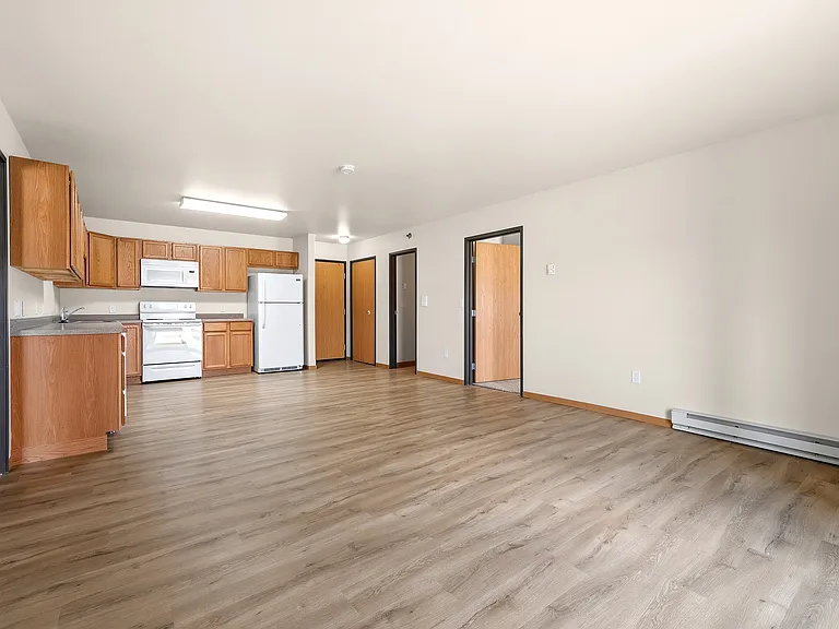 Step into a world of comfort at Paramount at the Bluffs Apartments. This spacious living area features modern finishes, ample natural light, and easy access to essential amenities. Elevate your lifestyle todayschedule a tour now!