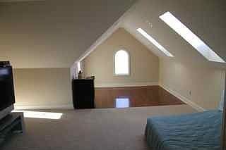 Master bedroom retreat/sitting area with french doors & sky lite