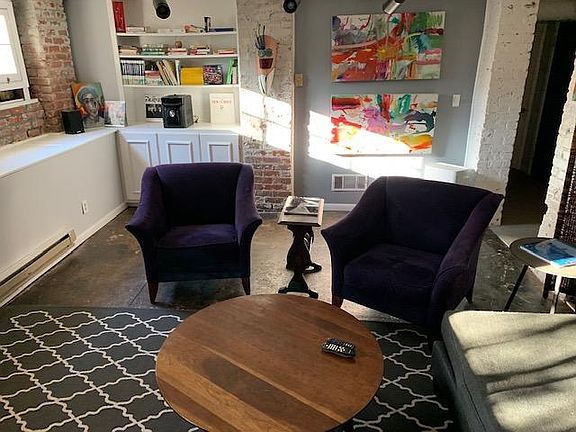 Stylish furniture with original concrete floors and plenty of sunlight