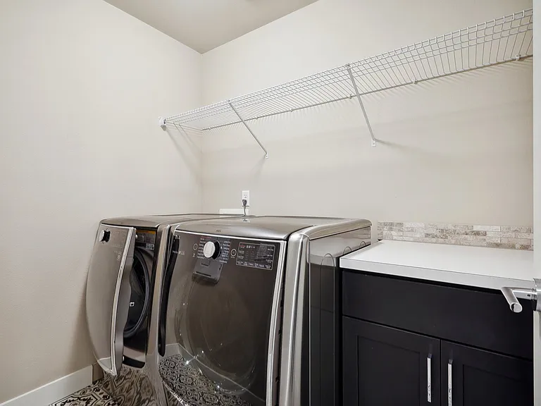 Large capacity washer and dryer with storage space