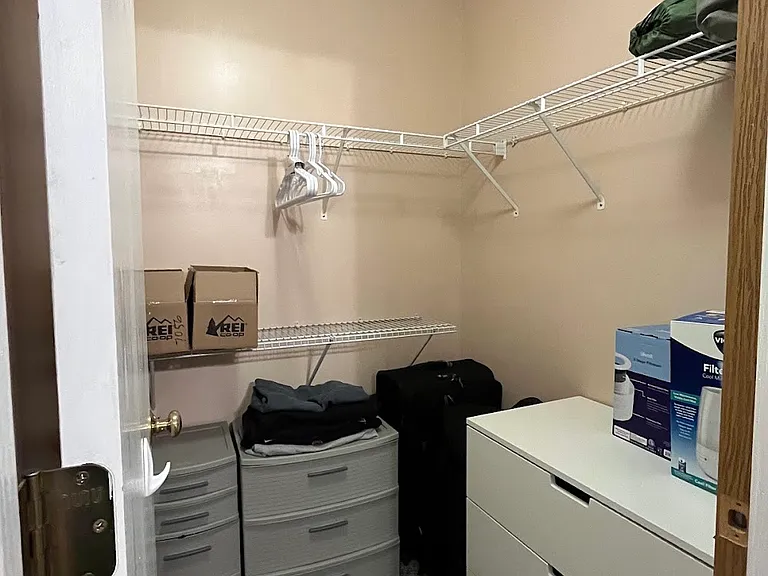 CURRENT photo - walk-in closest in room - how the currrent tenant likes to arrange their space