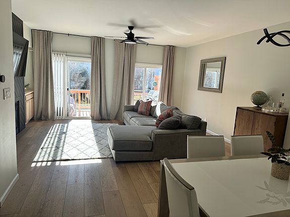 living room with dinning table seats 6 comfortably