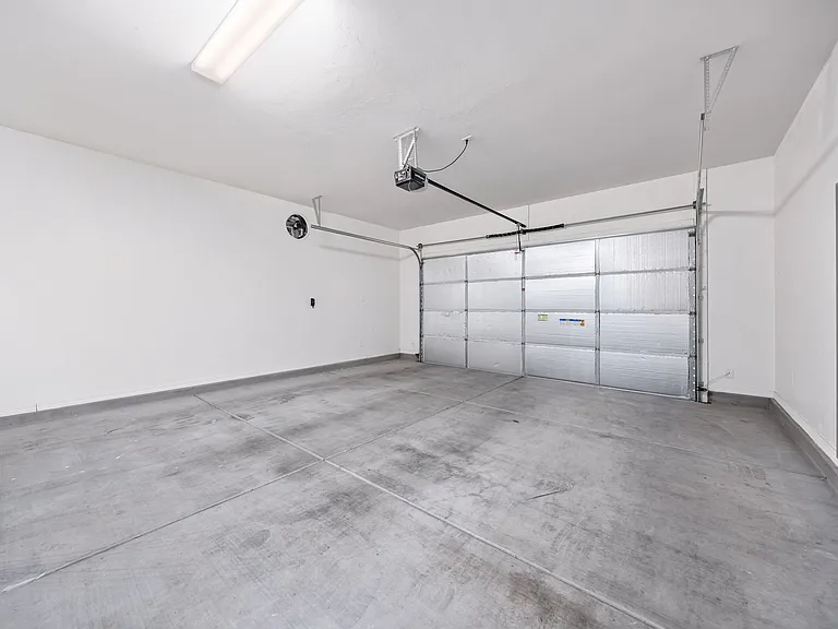 Insulated garage door and ventilation system added in garage to help control the heat in the summer