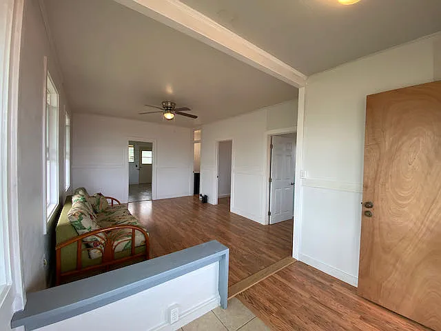 View from the front entrance of living room and connecting bedroom/bathroom doors