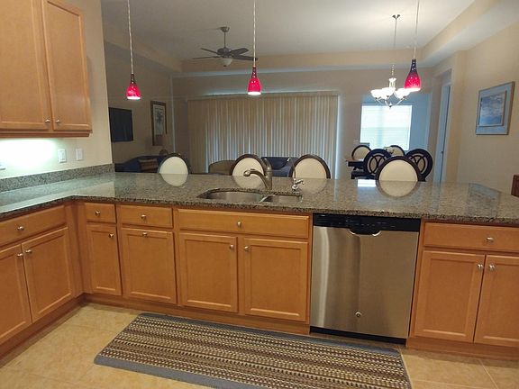 Spacious kitchen with expansive granite counter top.