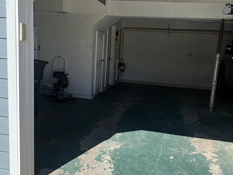 Single car garage bay slot (230 square feet) with included storage (102 square feet and under stairs 34 square feet) and private entrance from garage into apartment!