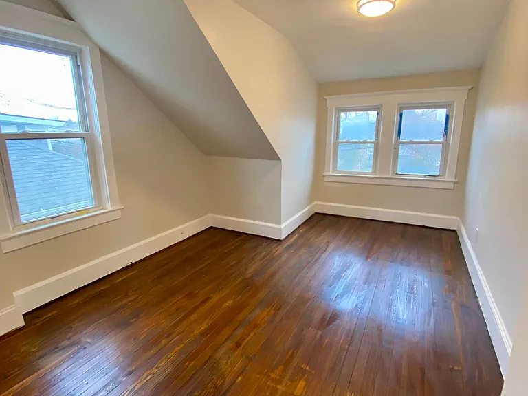 (second floor)top right large bedroom, plenty of windows and natural light