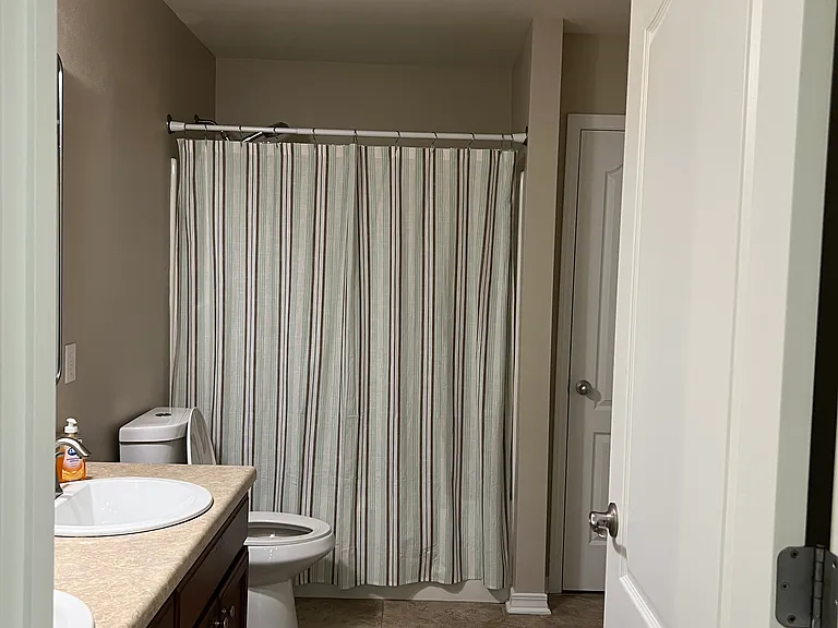Secondary bathroom on other side of the house next to two bedroom number 2 and bedroom number 4 this house has a gorgeous split floor plan.