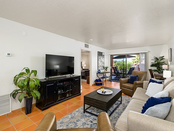 65" Smart TV with DISH cable channels as well as DVD and large movie selection in the entertainment center.