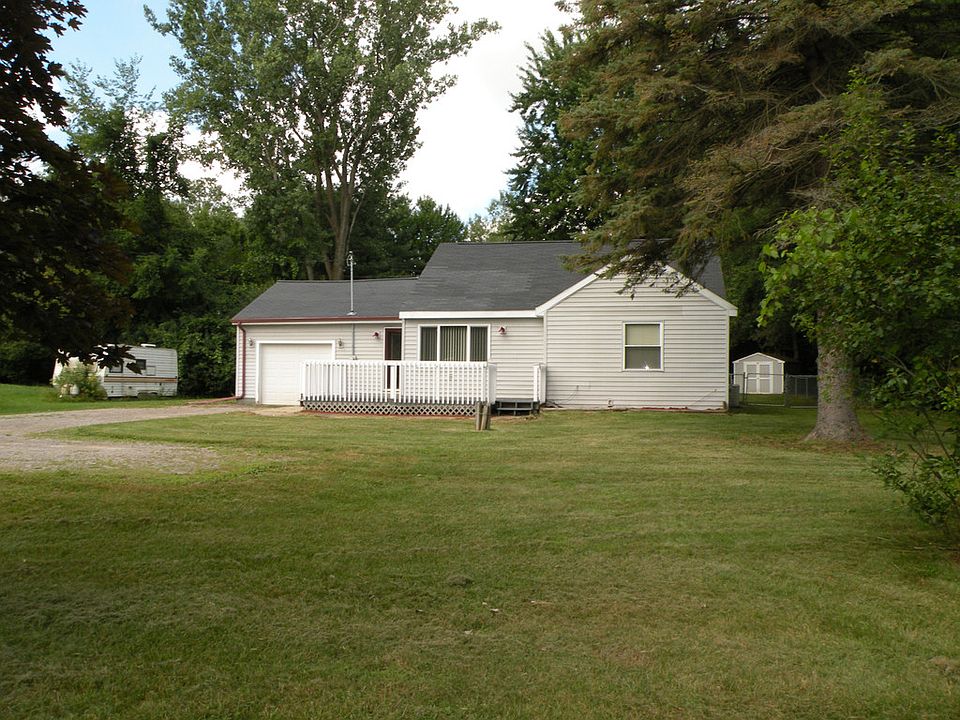 Three bedroom cape cod home on one acre in Midland Township. Bullock Creek Schools. 1.5 car attached