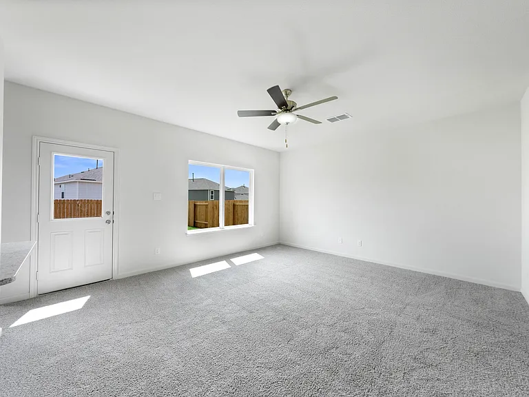 The spacious family room is perfect for family living and hosting.