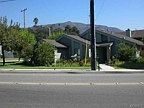 Located on a corner lot with lush landscaping this light