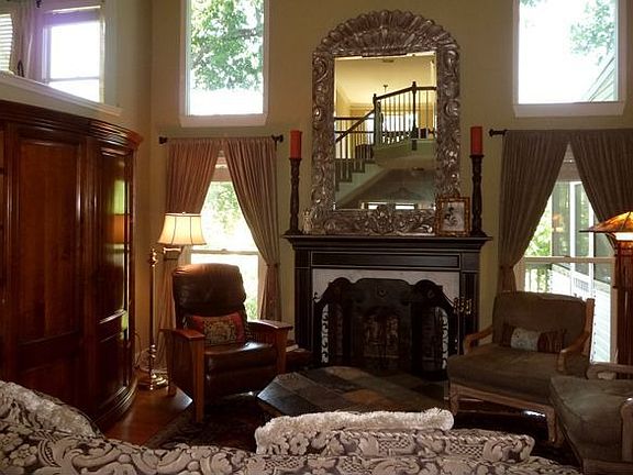 Living/Family Room faces into woods and overlooks lake