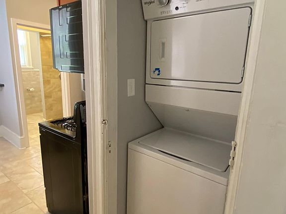 Convenience of brand new washer/dryer in unit Brand new tile throughout laundry area, kitchen, and bathroom