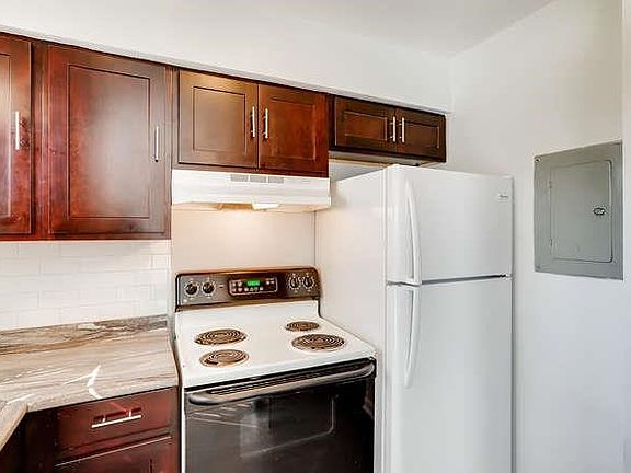 Beautiful new cabinets and appliances in kitchen.