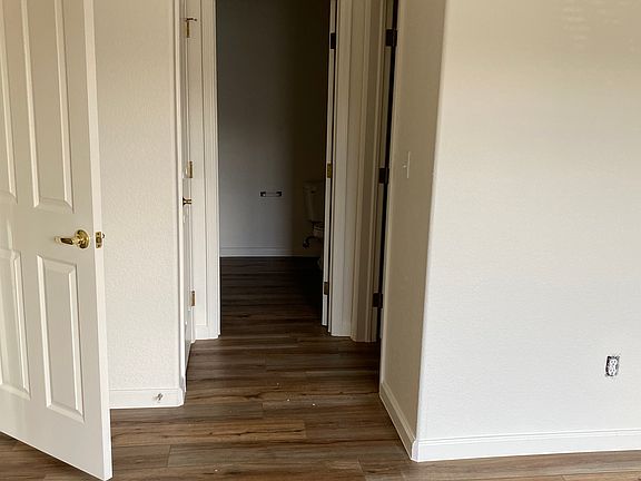 large primary bedroom with walk in closet and primary bath