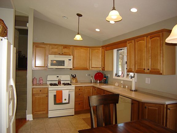 Kitchen, solid surface counters, new appliances and cabinets. 