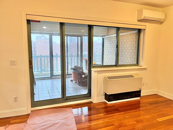 Living room looking at enclosed balcony