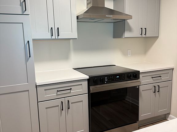 Brand new kitchen including appliances and cabinetry