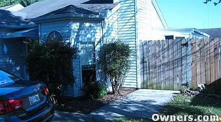 Bay window, chimney, back porch from SW