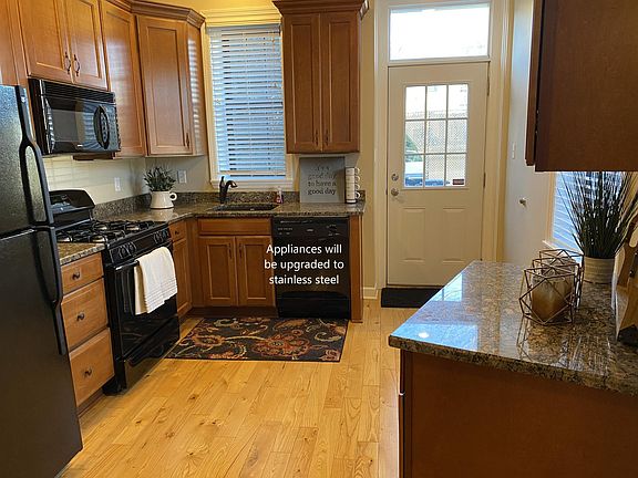 Kitchen with granite countertops. Appliances will be upgraded to stainless steel.