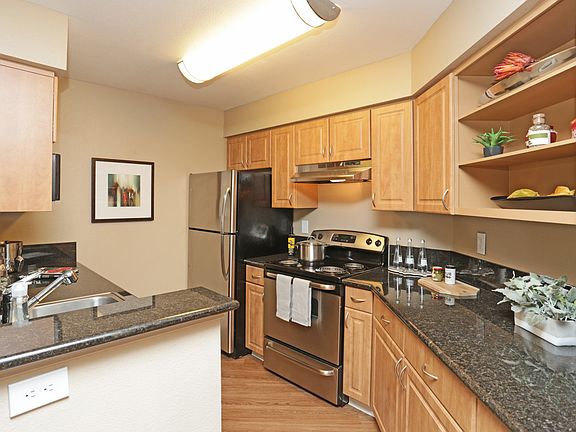 Kitchen is fully equipped with refrigerator, dishwasher, stove and range.