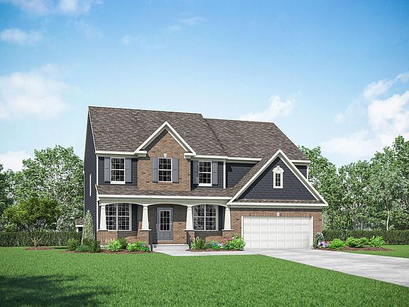 custom home with front porch and front-entry garage