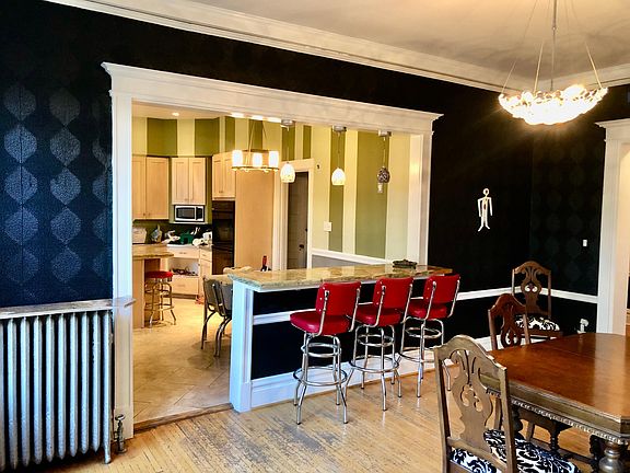 Kitchen and bar between kitchen and dining room.