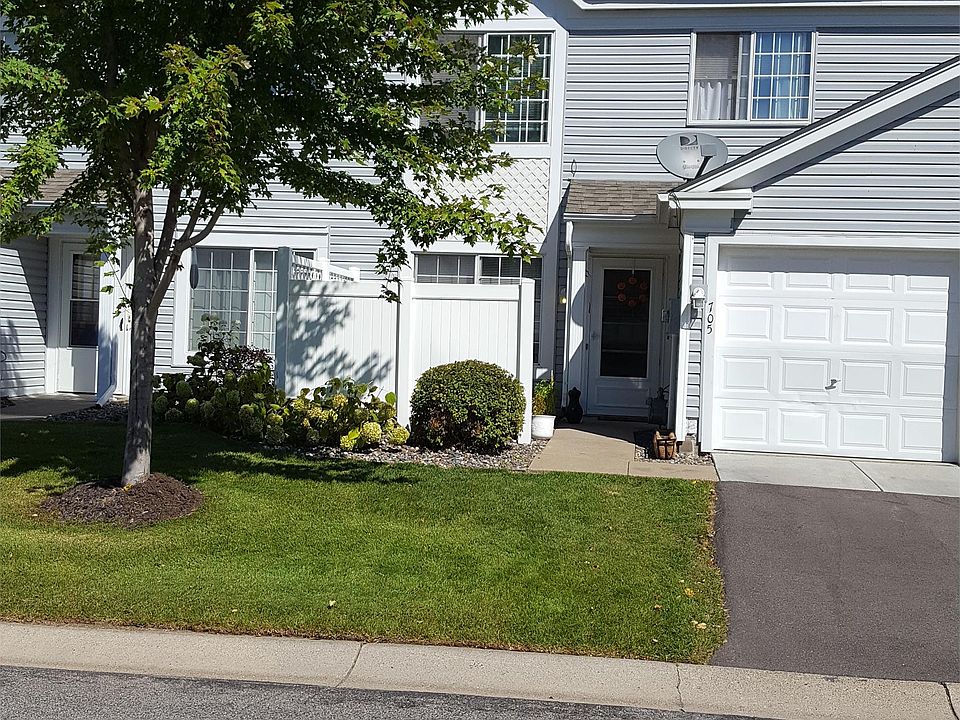Private garage, driveway and patio area.