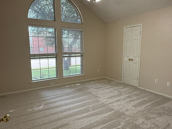 Master Bedroom_
w/ bathroom and walk-in closet; has high ceilings; windows face the front of the house
