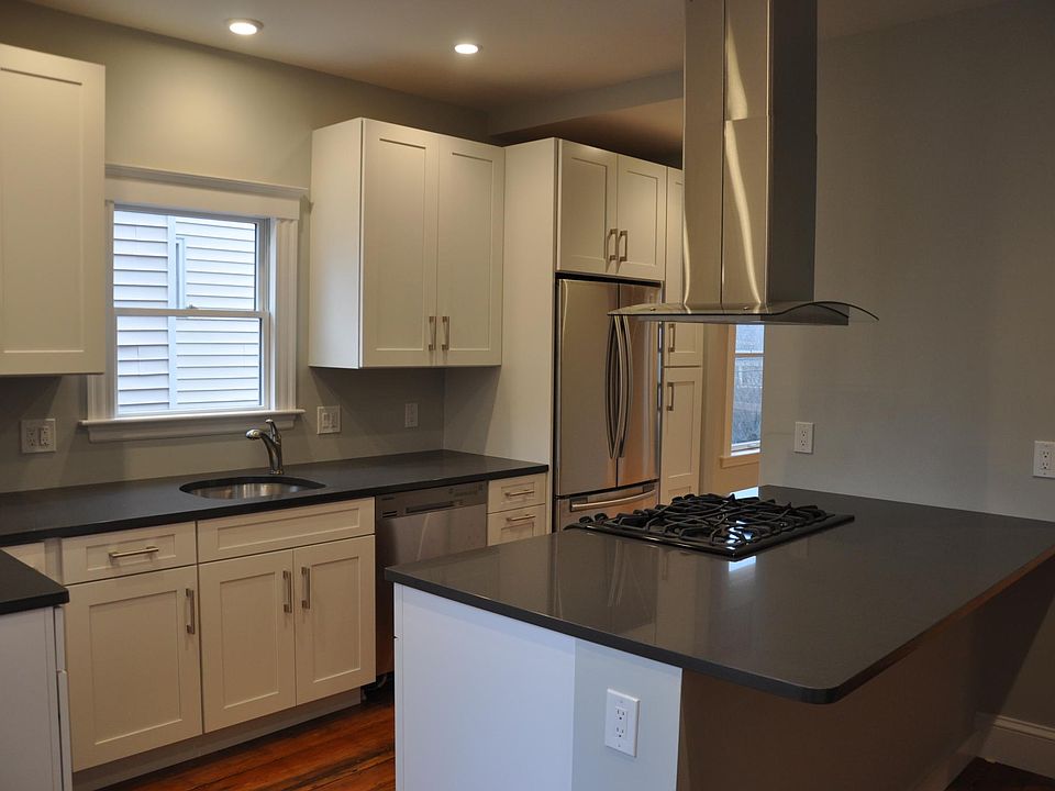 Cook's kitchen with modern appliances and new cabinets.
