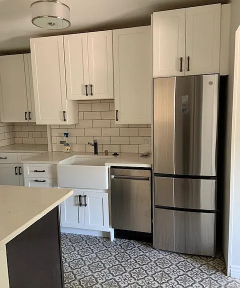 Amazing new stainless steel appliances--dishwasher, refrigerator, gas stove and microwave oven. Even the ceiling fixture matches!